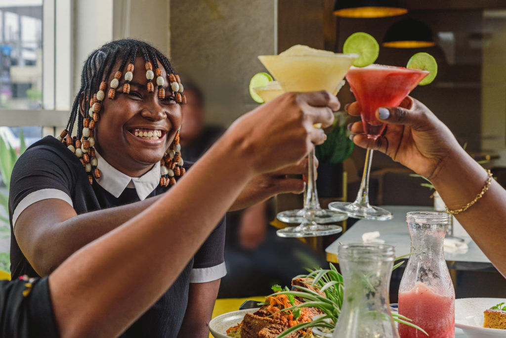 Happy Woman Having Drinks With Friends